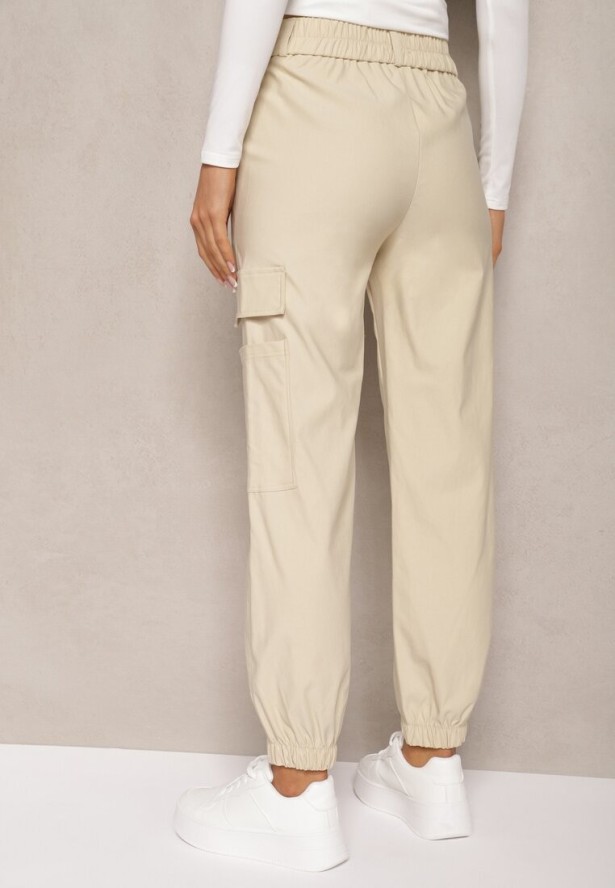Jasnobeżowe Zwężane Spodnie z Gumką w Pasie i Wsuwanymi Kieszeniami Lerana