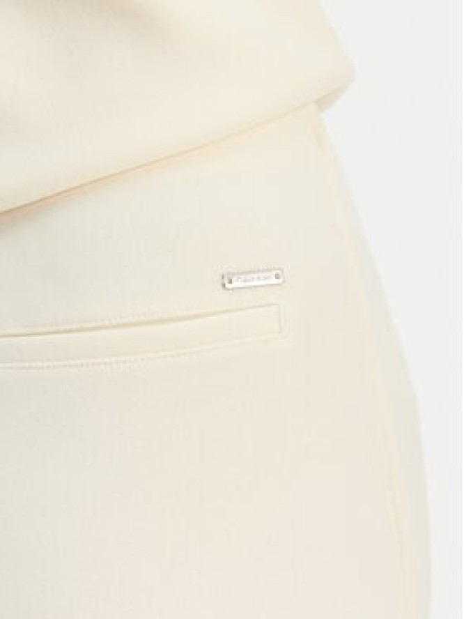 Calvin Klein Spodnie materiałowe LV044B223G Beżowy Flare Fit