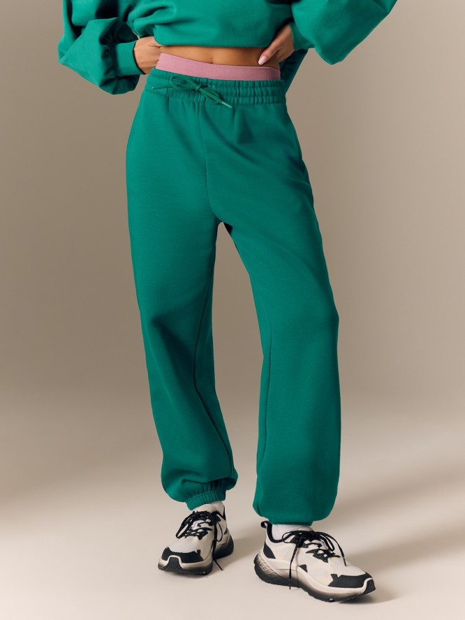 4F Spodnie dresowe joggery damskie - zielone S