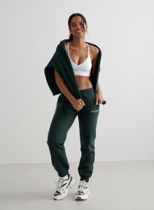 Damskie spodnie dresowe miękkie, drapane Varsity Classic ciemny szmaragd
