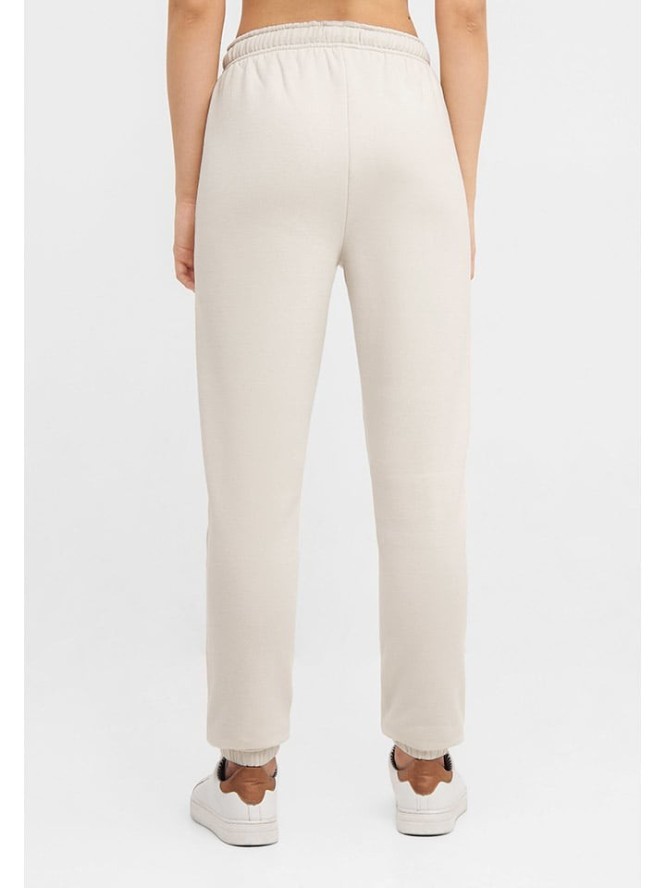 Bench Spodnie dresowe "Arth" w kolorze kremowym rozmiar: 38