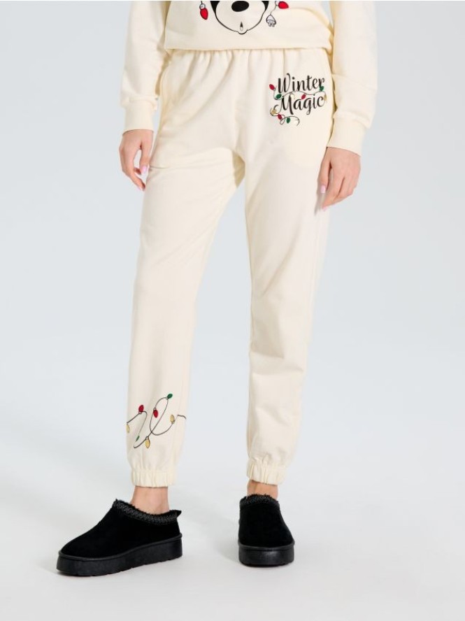 Spodnie dresowe Myszka Miki - kremowy
