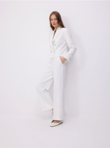 Szerokie spodnie z dekoracyjnymi guzikami - złamana biel