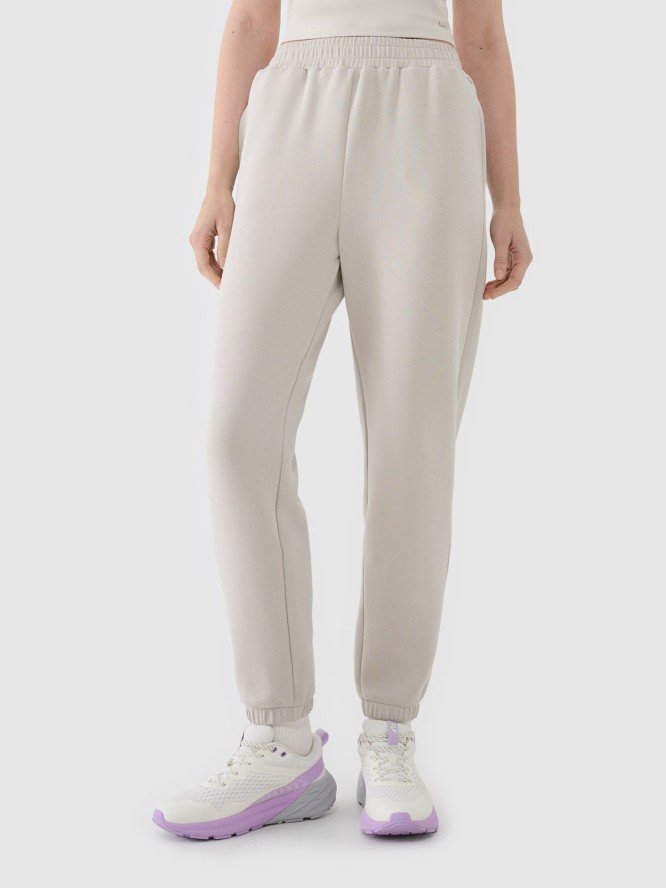 4F Spodnie dresowe joggery z modalem damskie - beżowe S