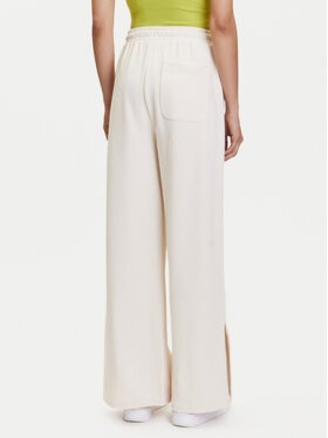 Puma Spodnie dresowe Her 685061 Beżowy Straight Fit