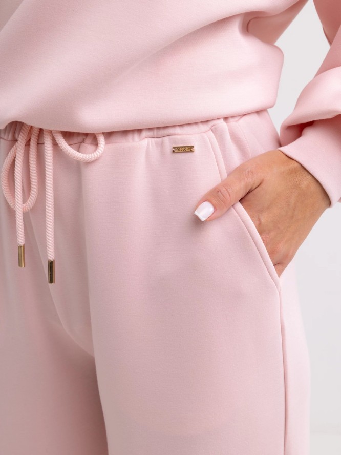 Spodnie damskie dresowe z szeroką nogawką jasnoróżowe Lunarap 600