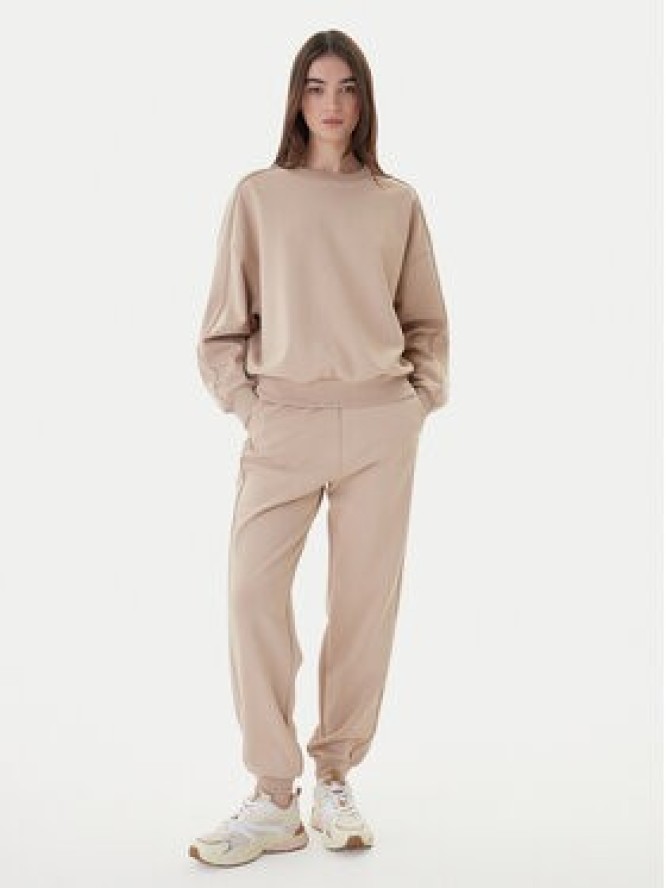 Guess Spodnie dresowe V5BB23 KCX22 Beżowy Regular Fit