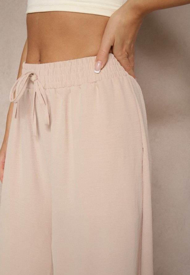 Beżowe Spodnie Palazzo o Szerokim Kroju Ozdobione Sznurkiem Ularira