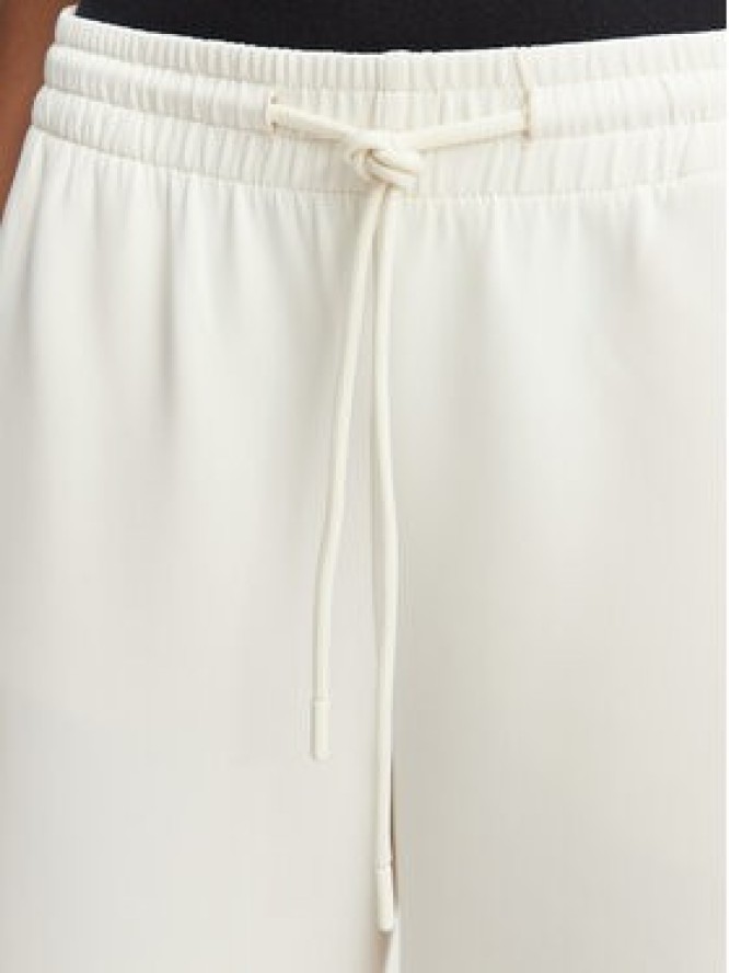 Guess Spodnie dresowe V6YB08 K4286 Kremowy Regular Fit