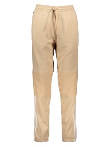 adidas Spodnie dresowe "Parley" w kolorze beżowym rozmiar: XXL