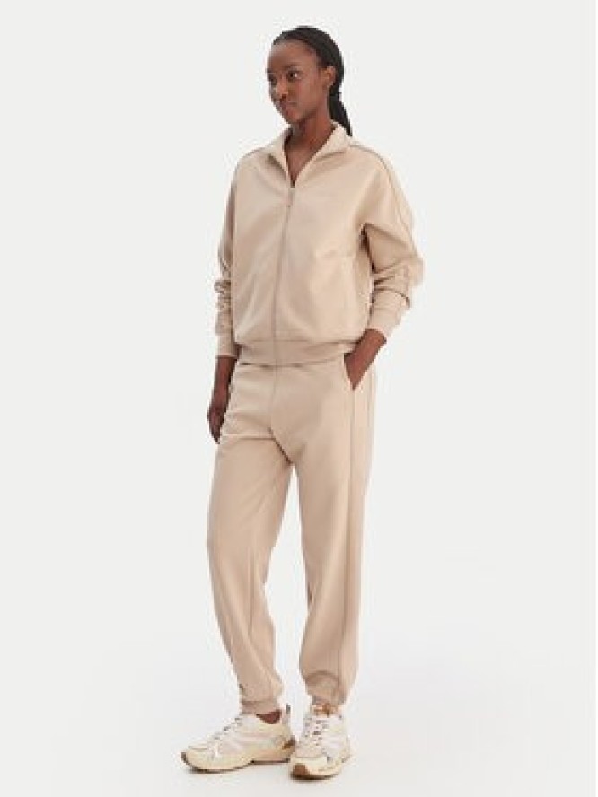 Guess Spodnie dresowe V5BB23 KCX22 Beżowy Regular Fit