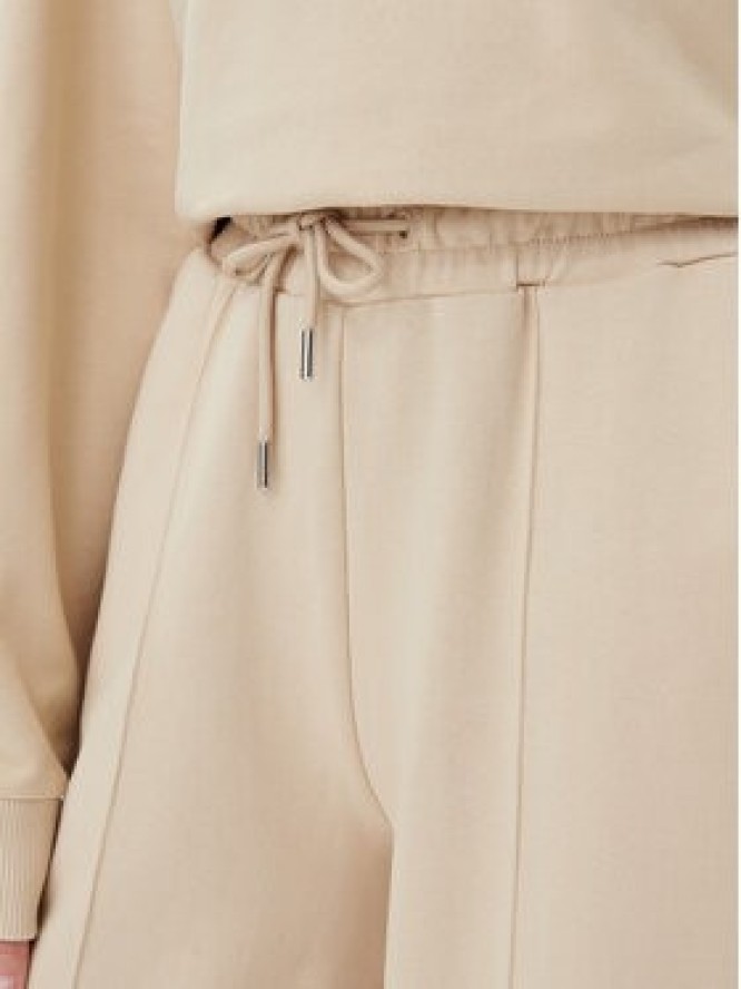 Guess Spodnie dresowe V5GB07 KCRP0 Beżowy Regular Fit