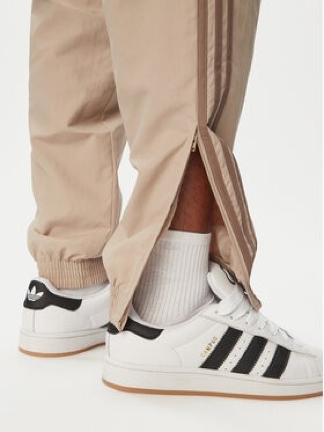 adidas Spodnie dresowe Firebird KS7503 Beżowy Regular Fit