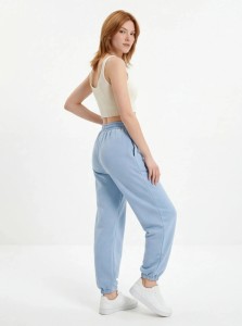 Damskie spodnie dresowe oversize UNLEASH WINGS PASTEL BLUE