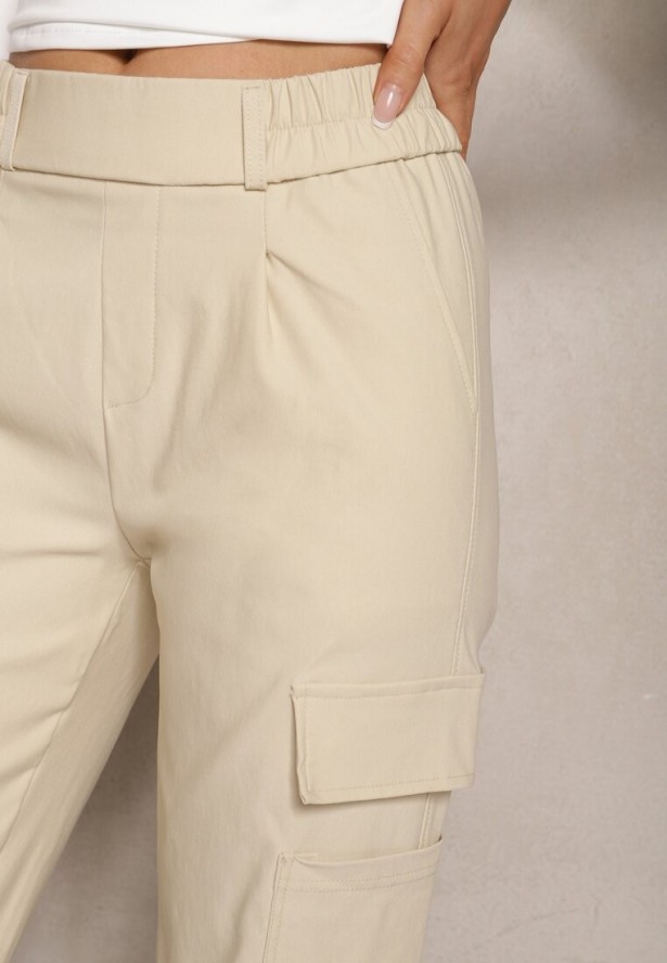 Jasnobeżowe Zwężane Spodnie z Gumką w Pasie i Wsuwanymi Kieszeniami Lerana