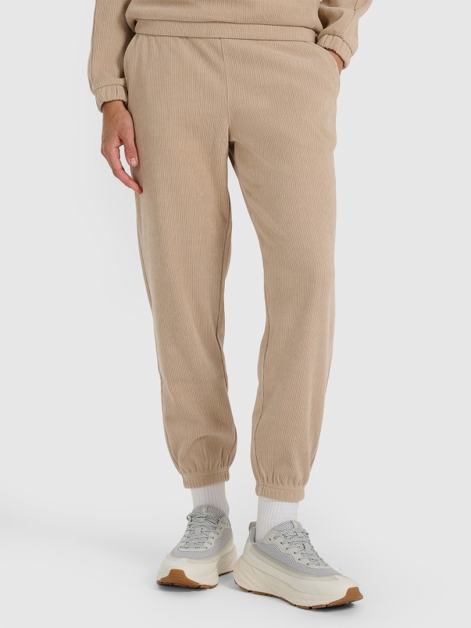 4F Spodnie dresowe joggery damskie - beżowe S