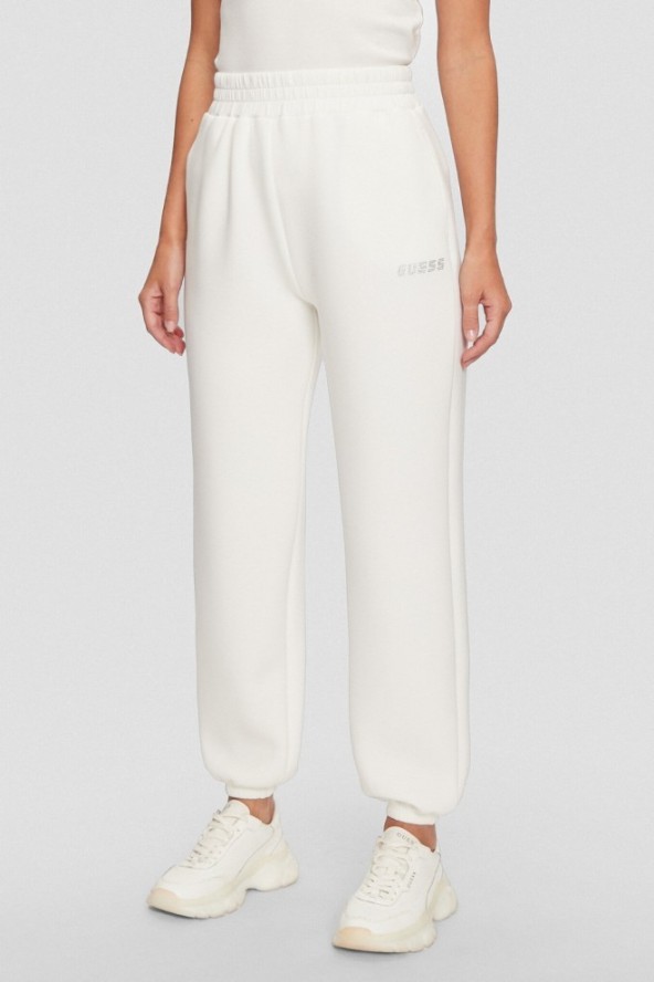 GUESS Dresowe damskie spodnie w kolorze ecru Cecilia Scuba, Rozmiar S