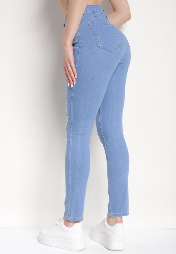 Niebieskie Dopasowane Jeansy Push-Up z Przetarciami i Regularnym Stanem Delosia