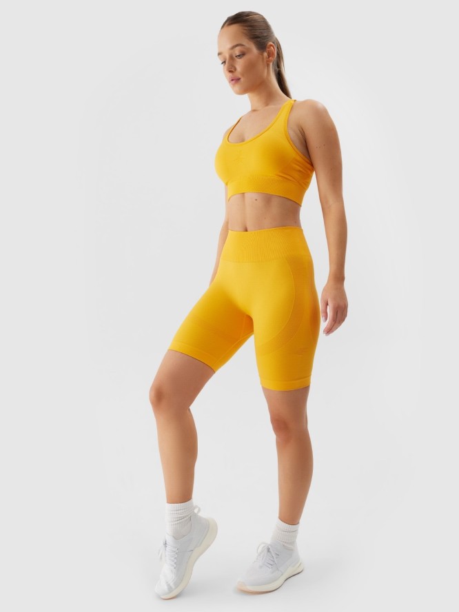 4F Legginsy krótkie bezszwowe treningowe damskie - pomarańczowe M/L