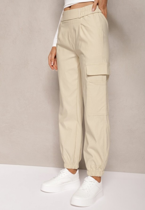 Jasnobeżowe Zwężane Spodnie z Gumką w Pasie i Wsuwanymi Kieszeniami Lerana
