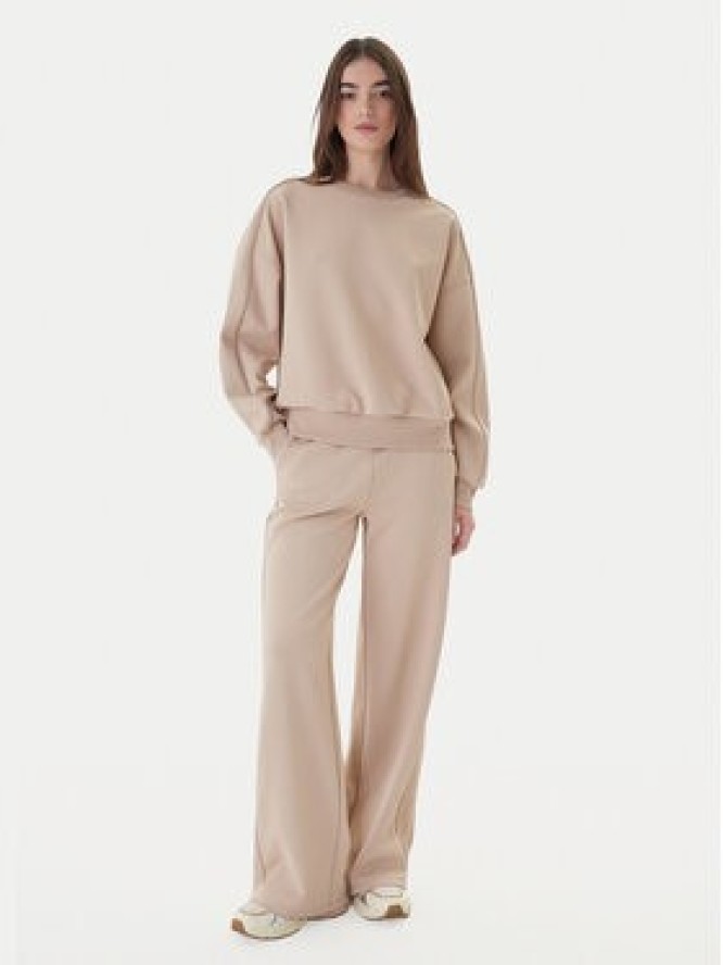 Guess Spodnie dresowe V5BB12 KCX22 Beżowy Regular Fit