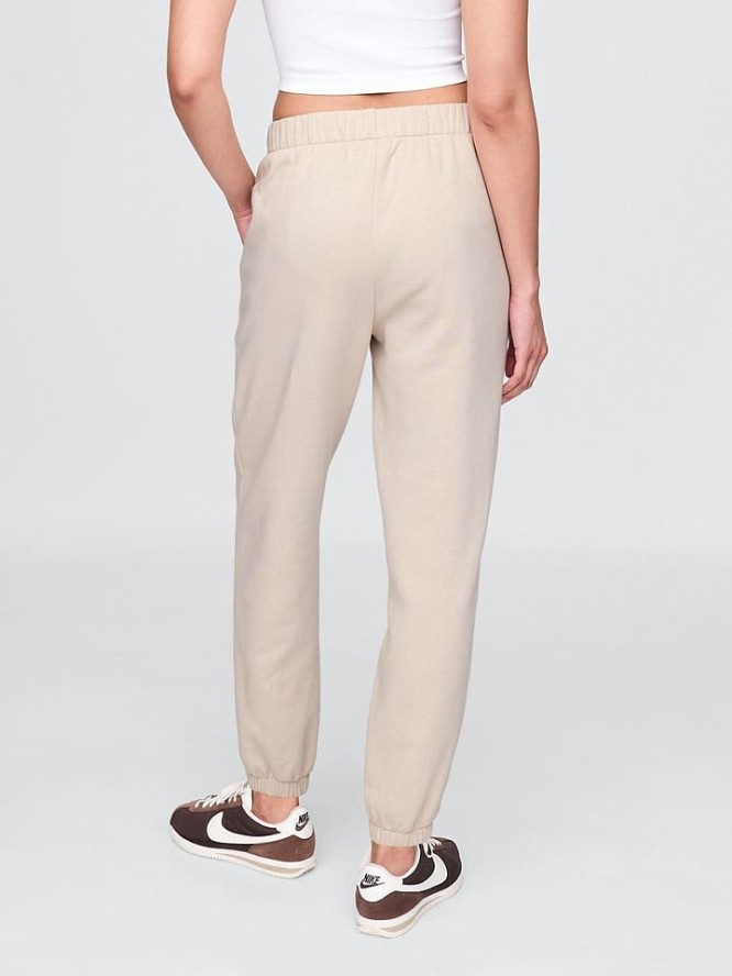 GAP Spodnie dresowe w kolorze beżowym rozmiar: M