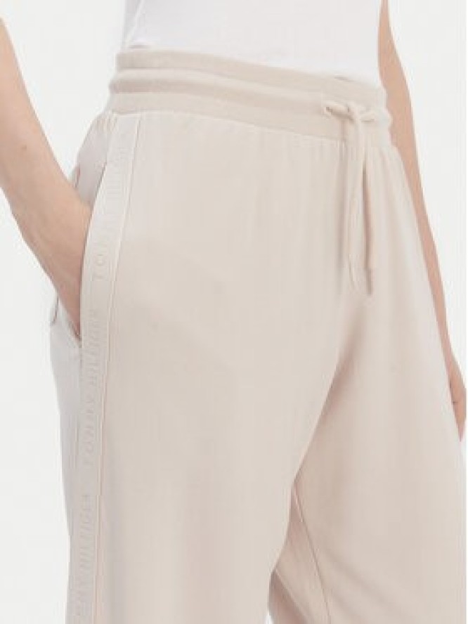 Tommy Hilfiger Spodnie dresowe UW0UW04771 Beżowy Relaxed Fit