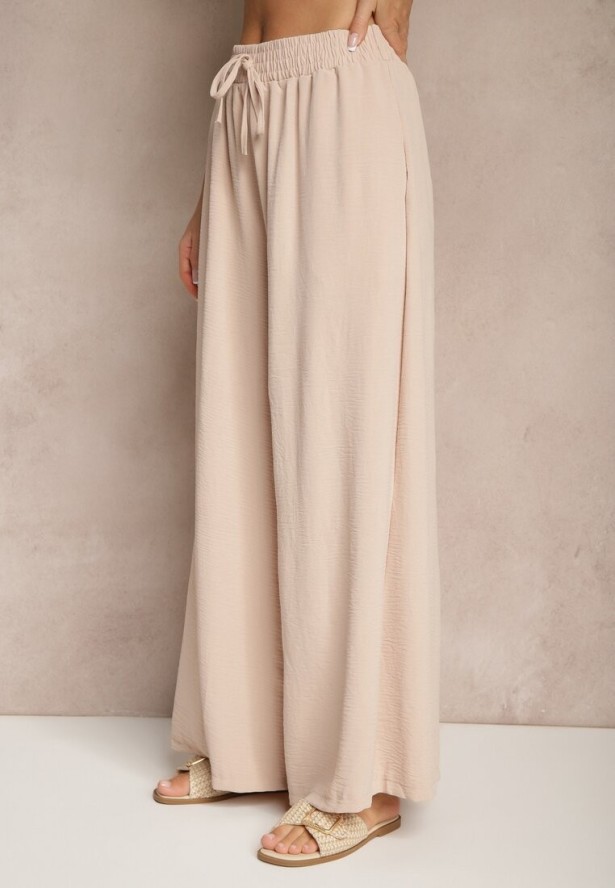 Beżowe Spodnie Palazzo o Szerokim Kroju Ozdobione Sznurkiem Ularira