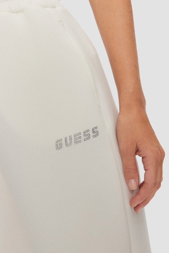 GUESS Dresowe damskie spodnie w kolorze ecru Cecilia Scuba, Rozmiar S