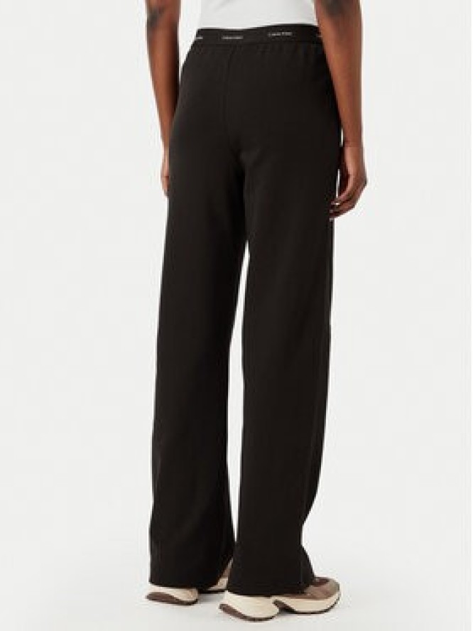 Calvin Klein Jeans Spodnie dresowe LV047G253G Brązowy ciemny Relaxed Fit