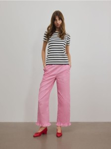 Spodnie z falbanką - różowy