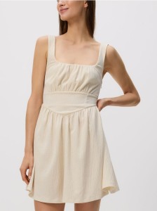 Kreszowana sukienka mini - kremowy