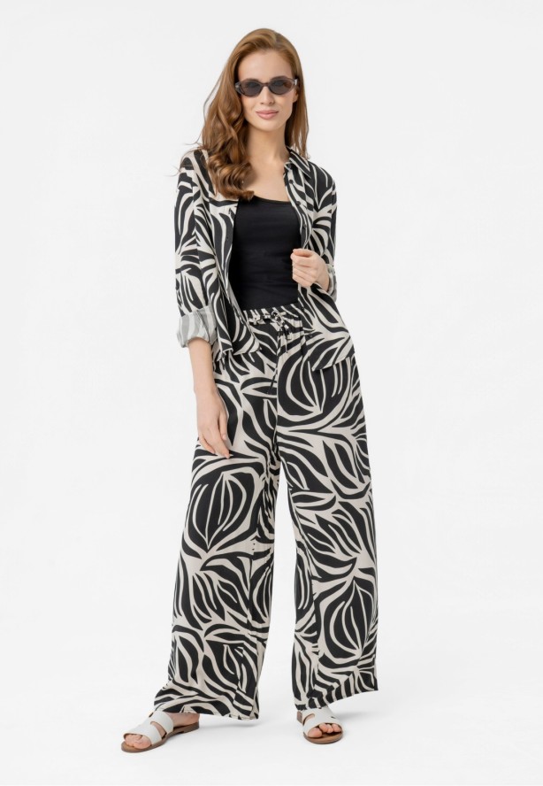 Luźne spodnie z wzorem R-DOLANA