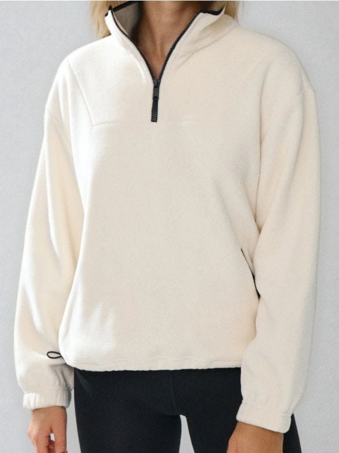 Polarowa bluza z krótkim zamkiem i regulowanym stoperami dołem - kremowy
