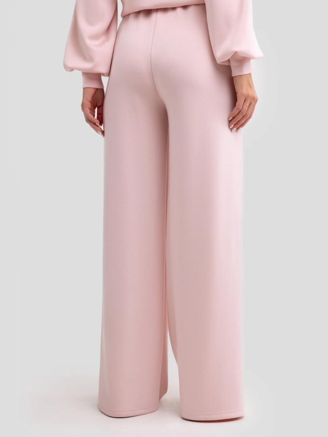 Spodnie damskie dresowe z szeroką nogawką jasnoróżowe Lunarap 600