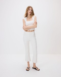 Spodnie flare z ażurowym wykończeniem - złamana biel
