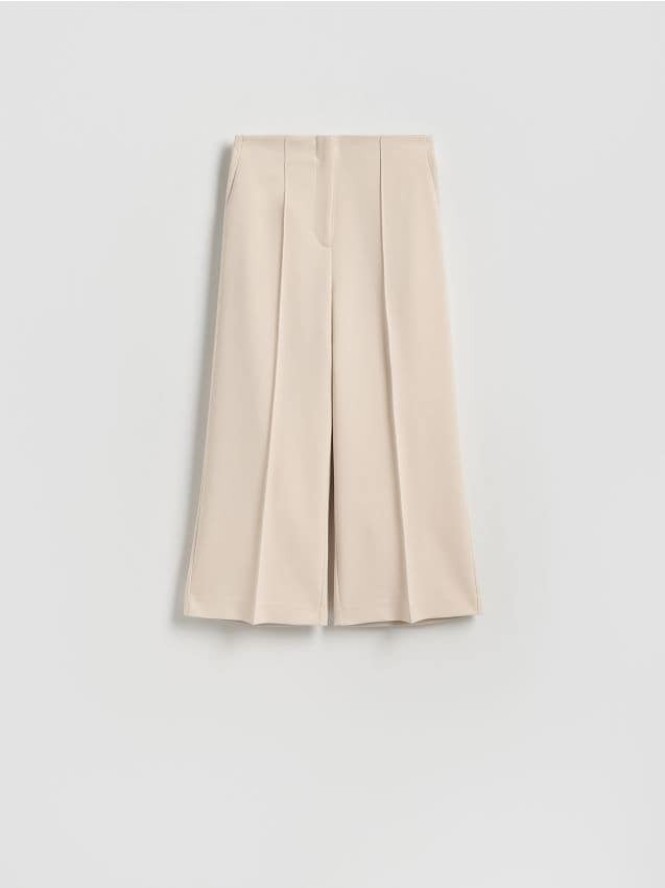 Spodnie culotte z kantem - beżowy