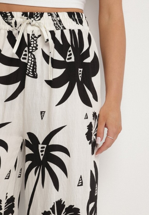 Czarno-Beżowe Spodnie z Tropikalnym Wzorem i Szerokimi Nogawkami Emivelli