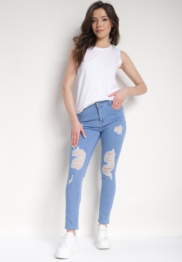 Niebieskie Dopasowane Jeansy Push-Up z Przetarciami i Regularnym Stanem Delosia