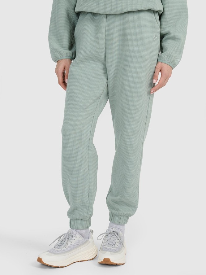4F Spodnie dresowe z waflowej dzianiny damskie - turkusowe XL