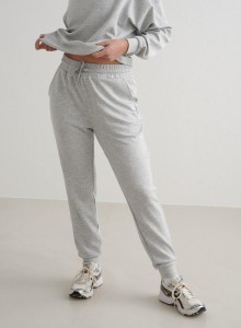 Damskie spodnie dresowe regular fit, ściągacze Comfy Modal jasnoszary melanż