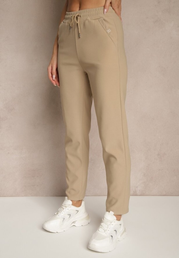 Jasnobeżowe Spodnie o Szerokim Kroju z Metalicznymi Ozdobami i Wiązaniem Voressa