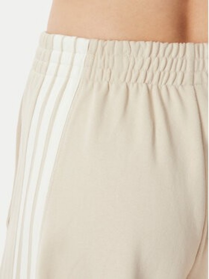 adidas Spodnie dresowe Kit 3-Stripes Wide KV9913 Beżowy Relaxed Fit