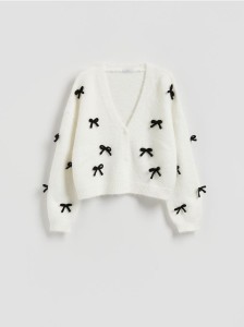 Sweter z kokardami - kremowy