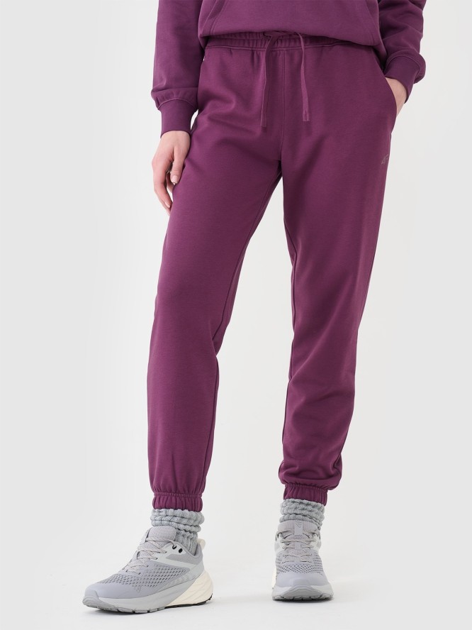 4F Spodnie dresowe joggery damskie - fioletowe L