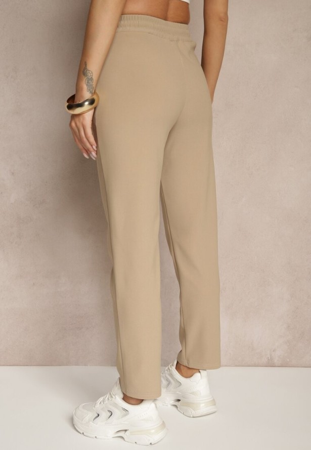 Jasnobeżowe Spodnie o Szerokim Kroju z Metalicznymi Ozdobami i Wiązaniem Voressa
