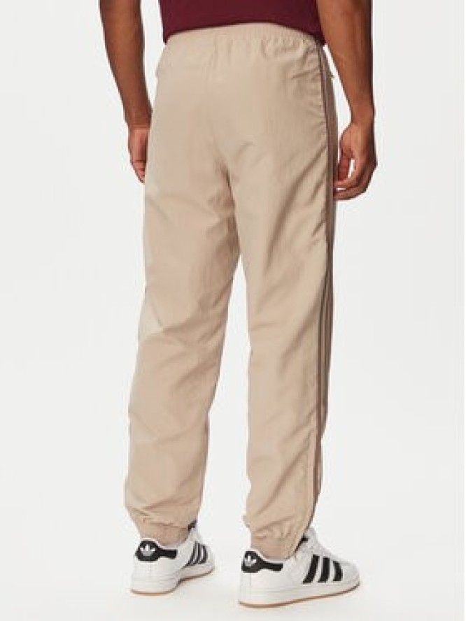 adidas Spodnie dresowe Firebird KS7503 Beżowy Regular Fit