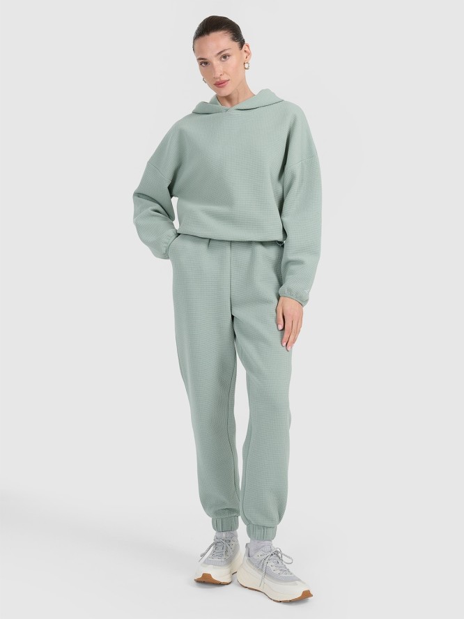 4F Spodnie dresowe z waflowej dzianiny damskie - turkusowe XL