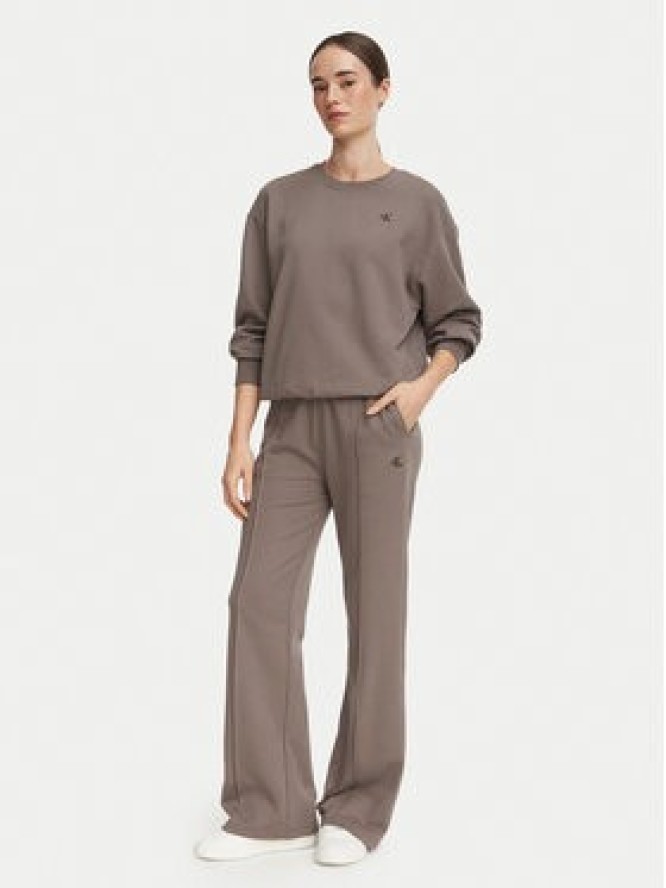Calvin Klein Jeans Spodnie dresowe Monogram LV047H220G Beżowy ciemny Flare Fit