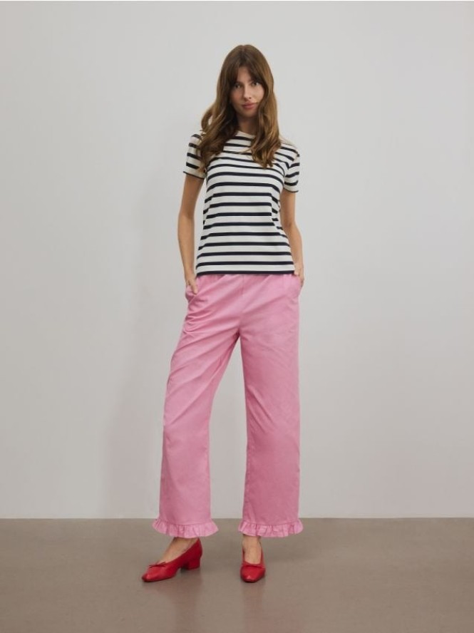 Spodnie z falbanką - różowy